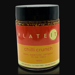 Plateit Chilli Crunch jar on a black background