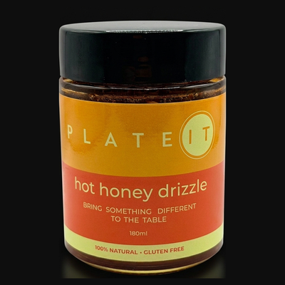 Plateit Hot Honey Drizzle jar on a black background