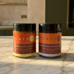 The Truffle Pack: Truffle Chilli Crunch and Truffled Hot Honey Drizzle on a marble worktop