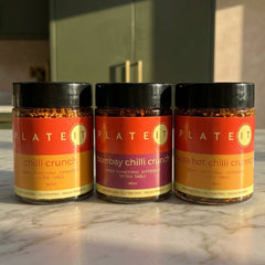 The Heat Starter: Chilli Crunch, Bombay Chilli Crunch and Extra Hot Chilli Crunch on a marble worktop