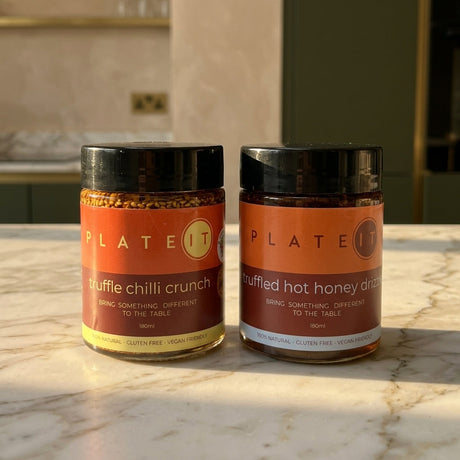 The Truffle Pack: Truffle Chilli Crunch and Truffled Hot Honey Drizzle on a marble worktop